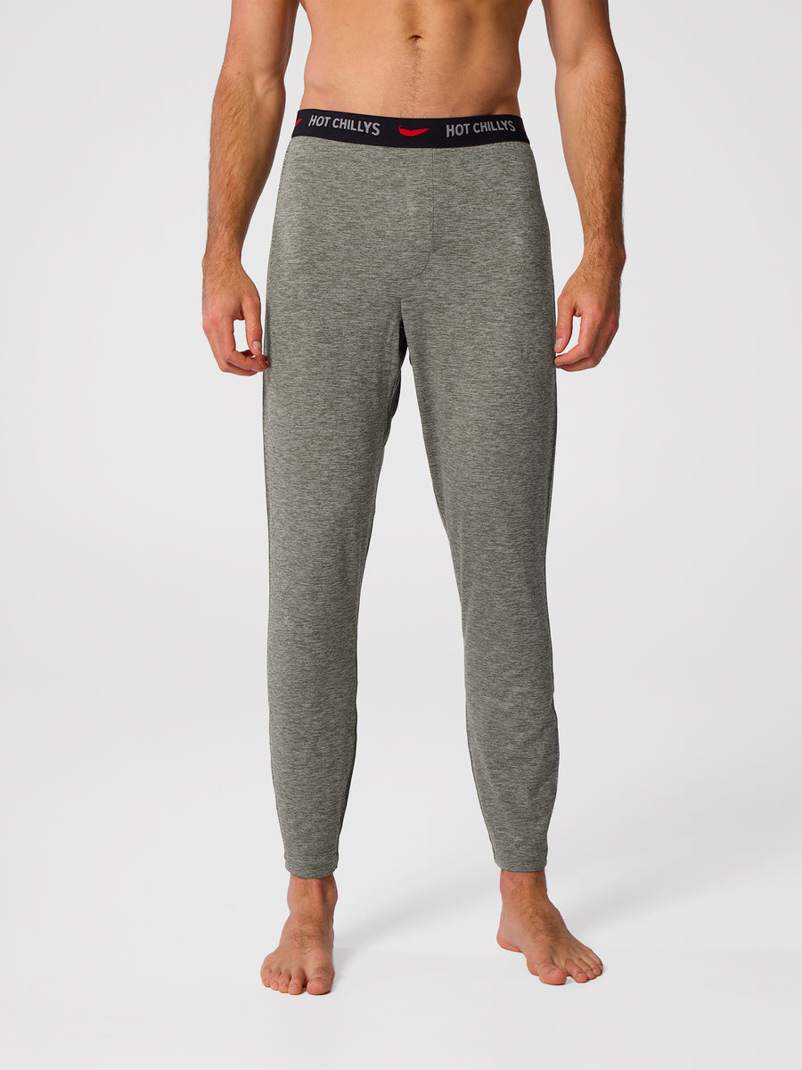 Man wearing Hot Chillys Clima-Tek bottom base layer in dark olive