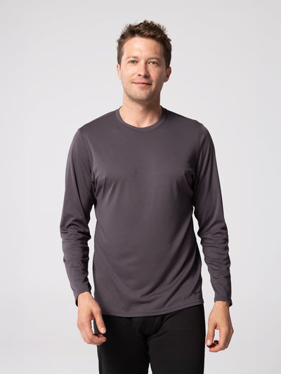 Man wearing Hot Chillys Peach Solid crewneck base layer top in Noche