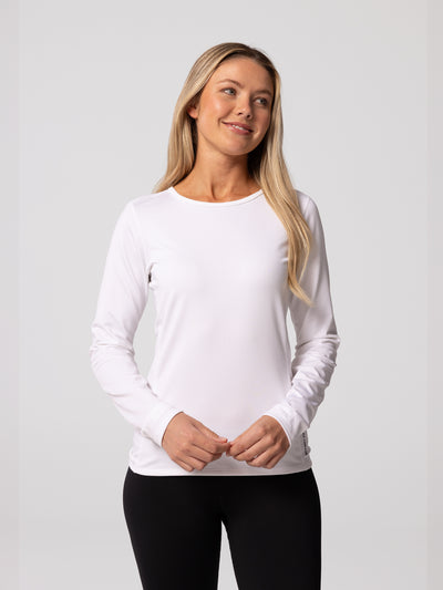 Woman wearing Hot Chillys Micro-Elite Chamois base layer top in white