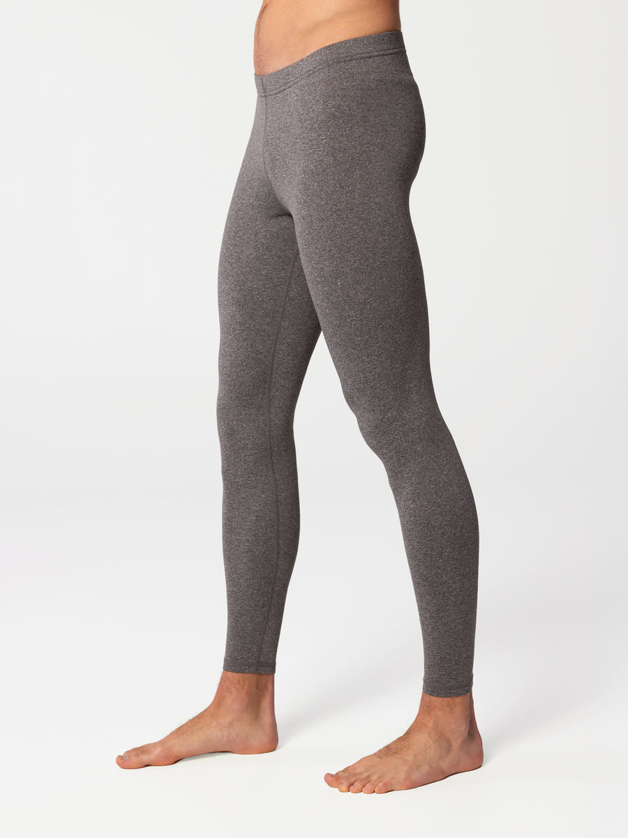 Side view of man wearing Hot Chillys Micro-Elite Chamois granite thermal tights