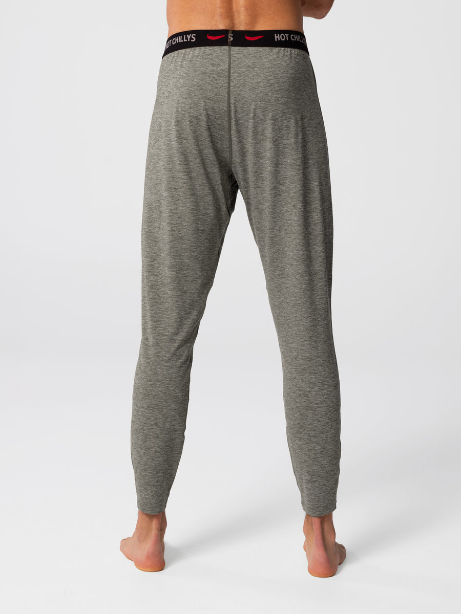 Man wearing Hot Chillys Clima-Tek bottom base layer in dark olive