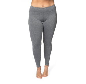 Gray leggings worn by a person on a white background
