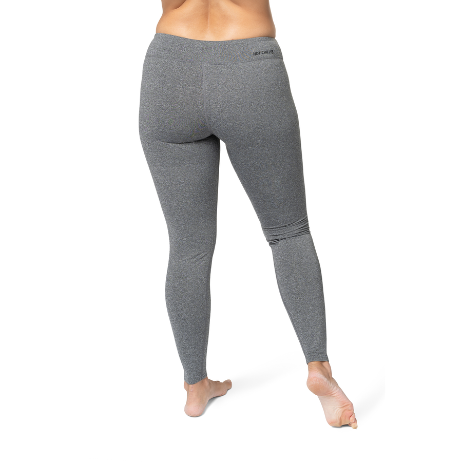 Gray leggings worn by a person on a white background