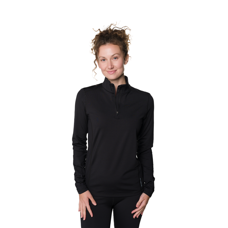 Woman wearing a black long-sleeve athletic top on a white background