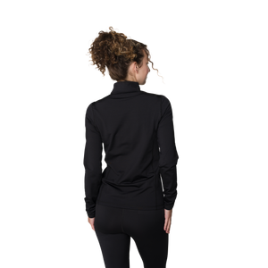 Person wearing a black long-sleeve top on a white background