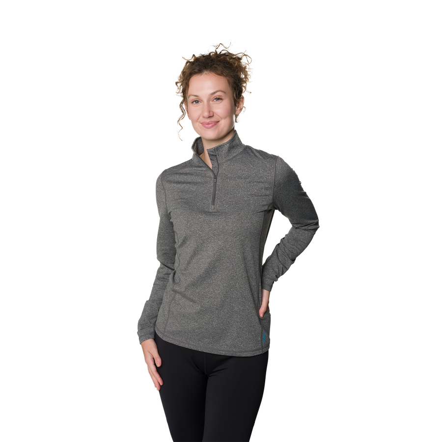 Woman wearing a gray long-sleeve shirt with a quarter zip on a white background