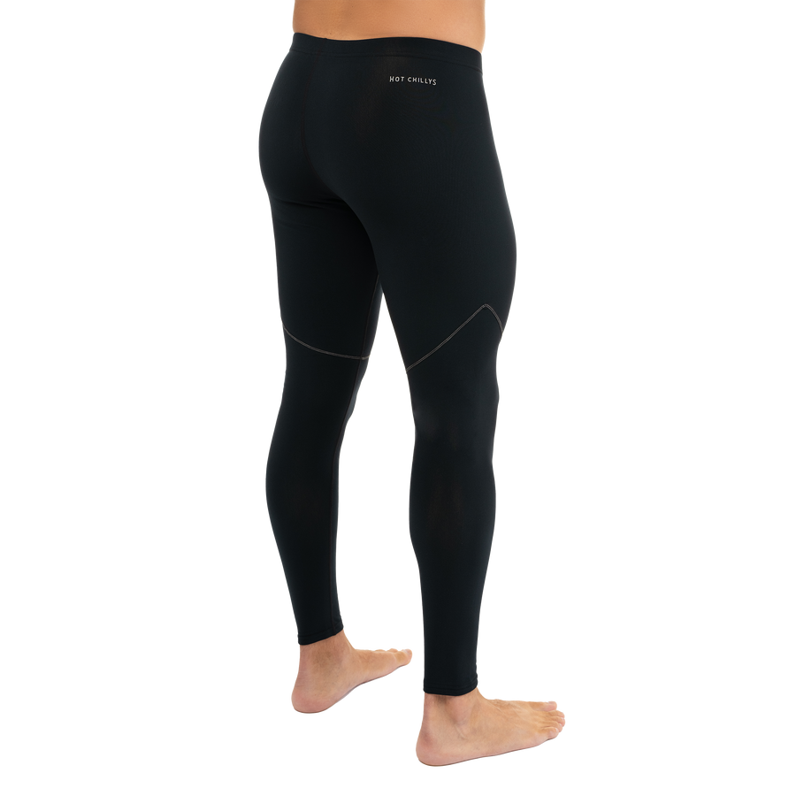 Side view of man wearing Hot Chillys Micro-Elite XT black and grey thermal tights