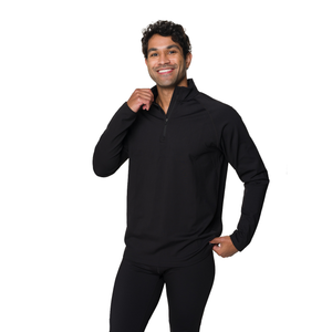 A man wearing a black long-sleeve quarter-zip athletic pullover and matching black pants, standing against a plain white background.