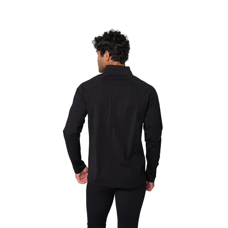 A man viewed from the back wearing a black long-sleeve mock neck shirt and black pants against a solid white background.