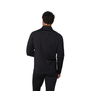 Person wearing a black long-sleeve shirt and pants on a white background