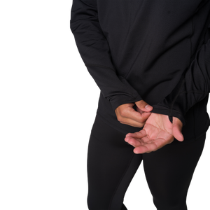 Person wearing a black long-sleeve shirt and pants on a white background