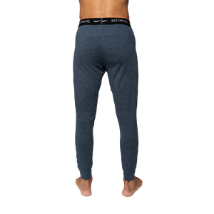 Hot Chillys men's thermal base layer pants in blue shown from the back for cold weather comfort