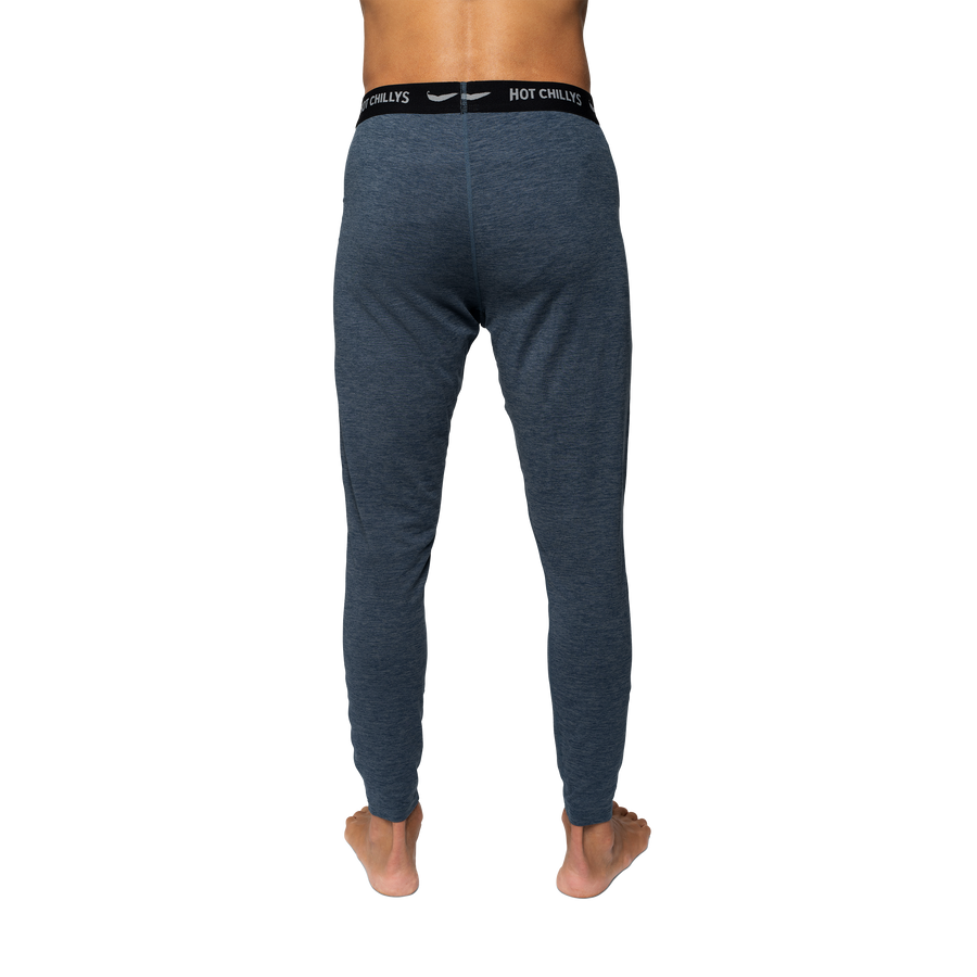 Hot Chillys men's thermal base layer pants in blue shown from the back for cold weather comfort
