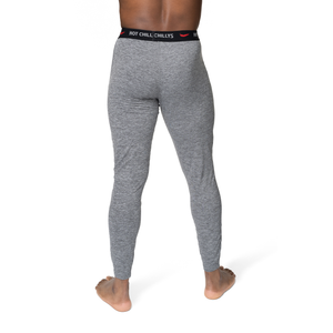Hot Chillys men's thermal base layer pants in gray shown from the back for cold weather comfort