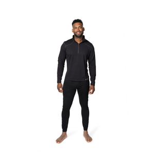 Hot Chillys men's black thermal zip shirt worn by male model standing barefoot on white background