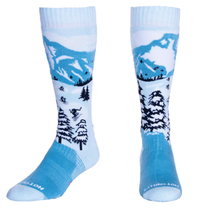 Hot Chillys mid volume cold weather socks with mountain and winter forest design in blue and white
